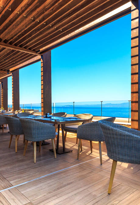 Kritamo Restaurant balcony tables with view of the sea