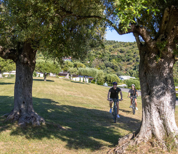 Miraggio visitors cycling in the forest