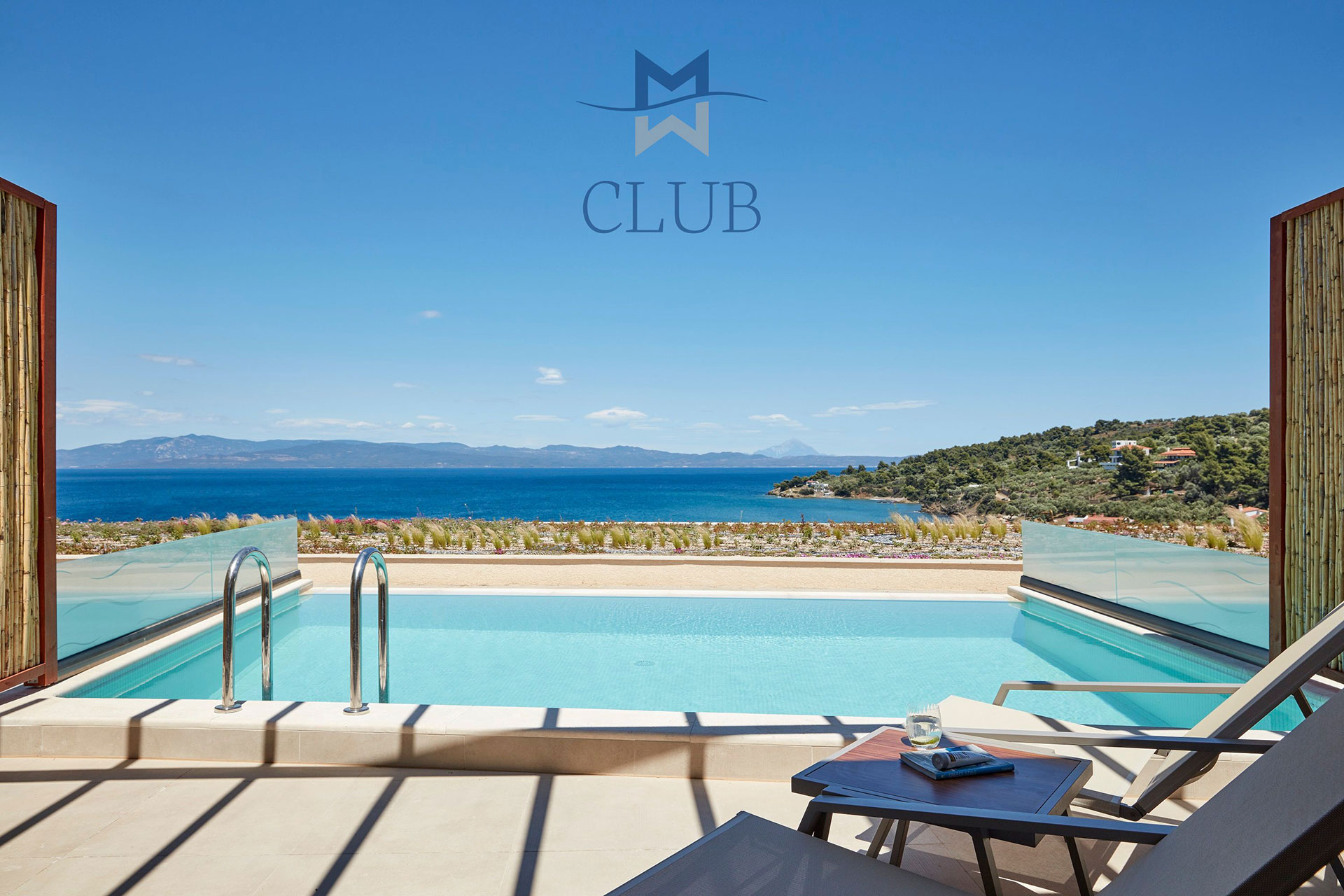 Club sea view room's private terrace with pool, sun loungers under wooden pergola and bamboo wall dividers