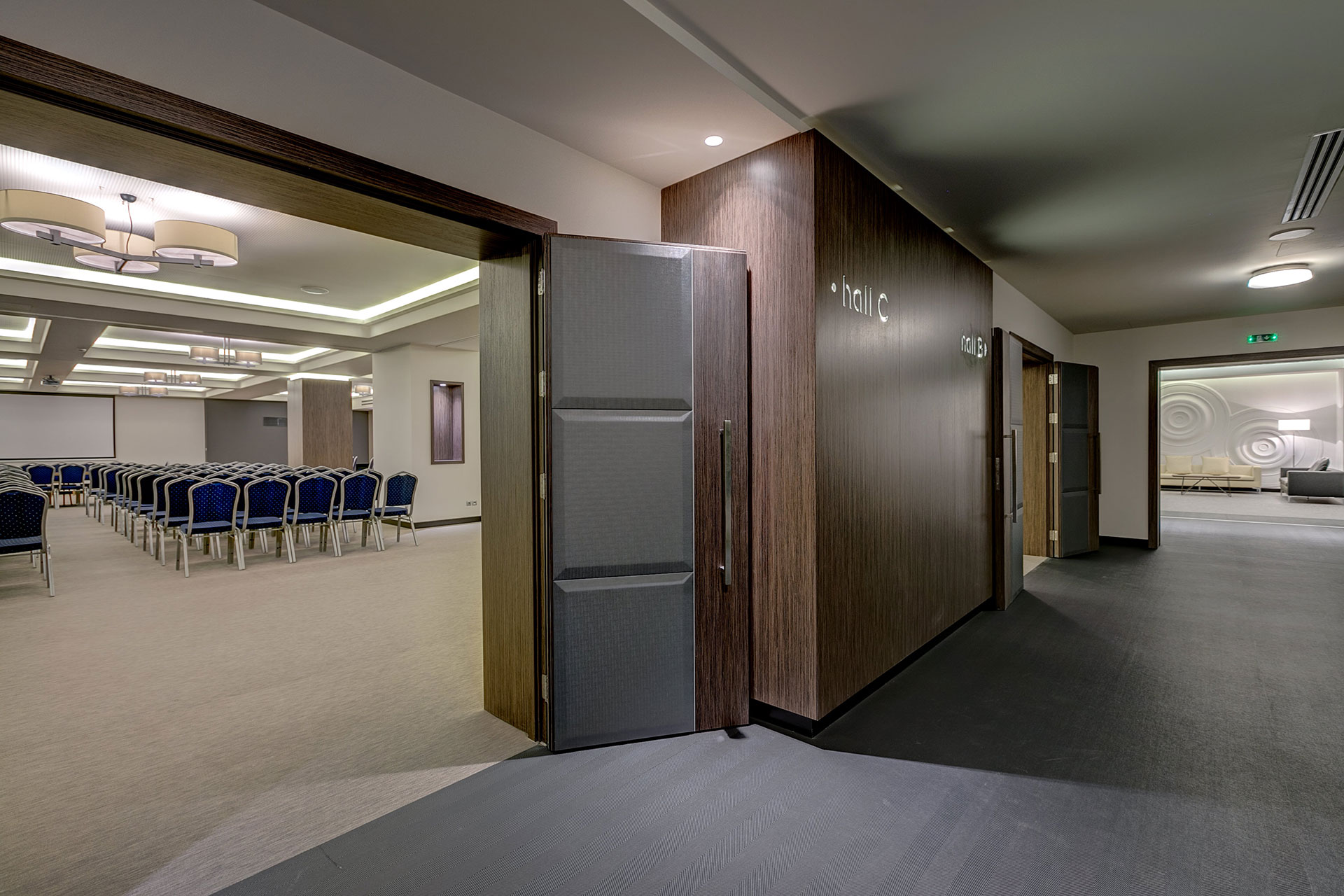 Entrance view of a modern conference hall with elegant lighting with neatly arranged seating