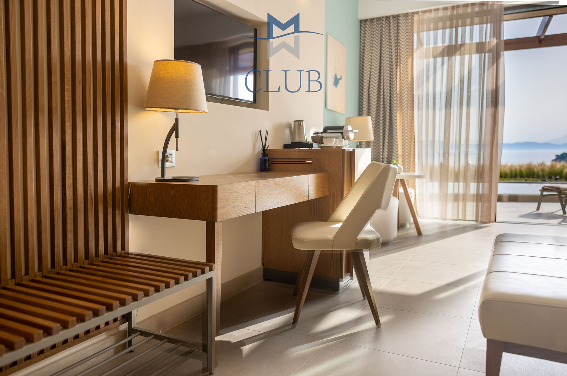 Close up to club sea view room's wooden working desk with modern furniture, and sea view 