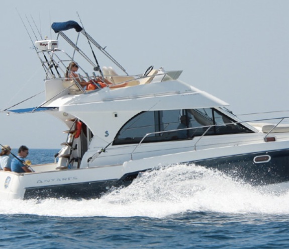 Luxury yacht Antares Blu cruising through the Aegean Sea under clear skies