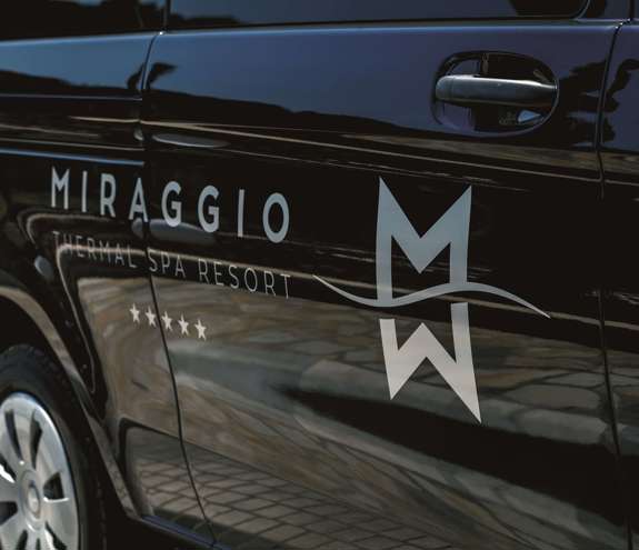 Close up to black glossy car with the Miraggio Thermal Spa Resort logo on it