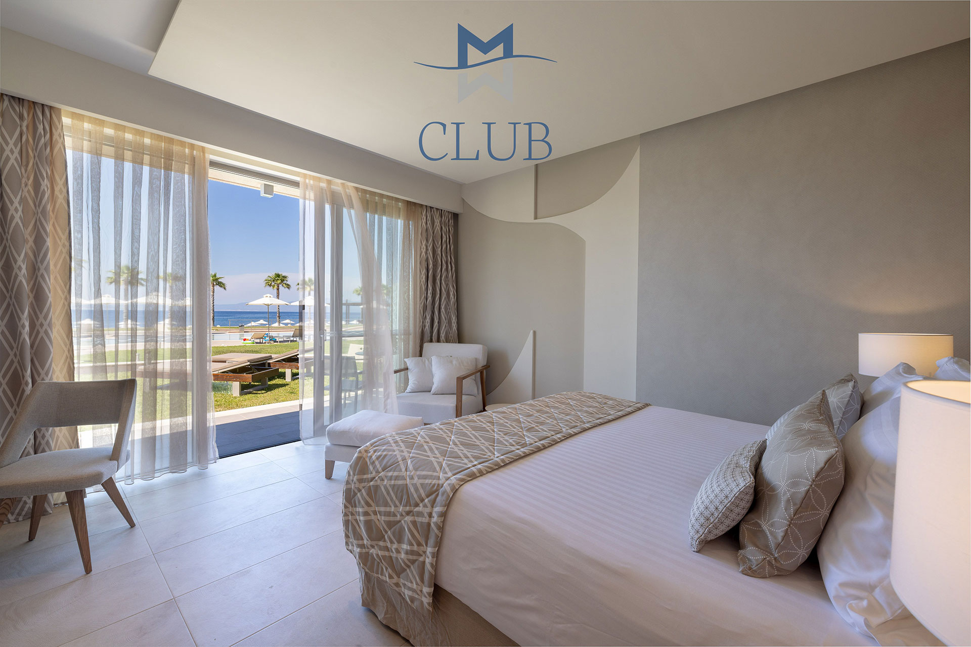 Modern ground floor suite with soft double bed, modern furniture and glass doors with garden and pool view