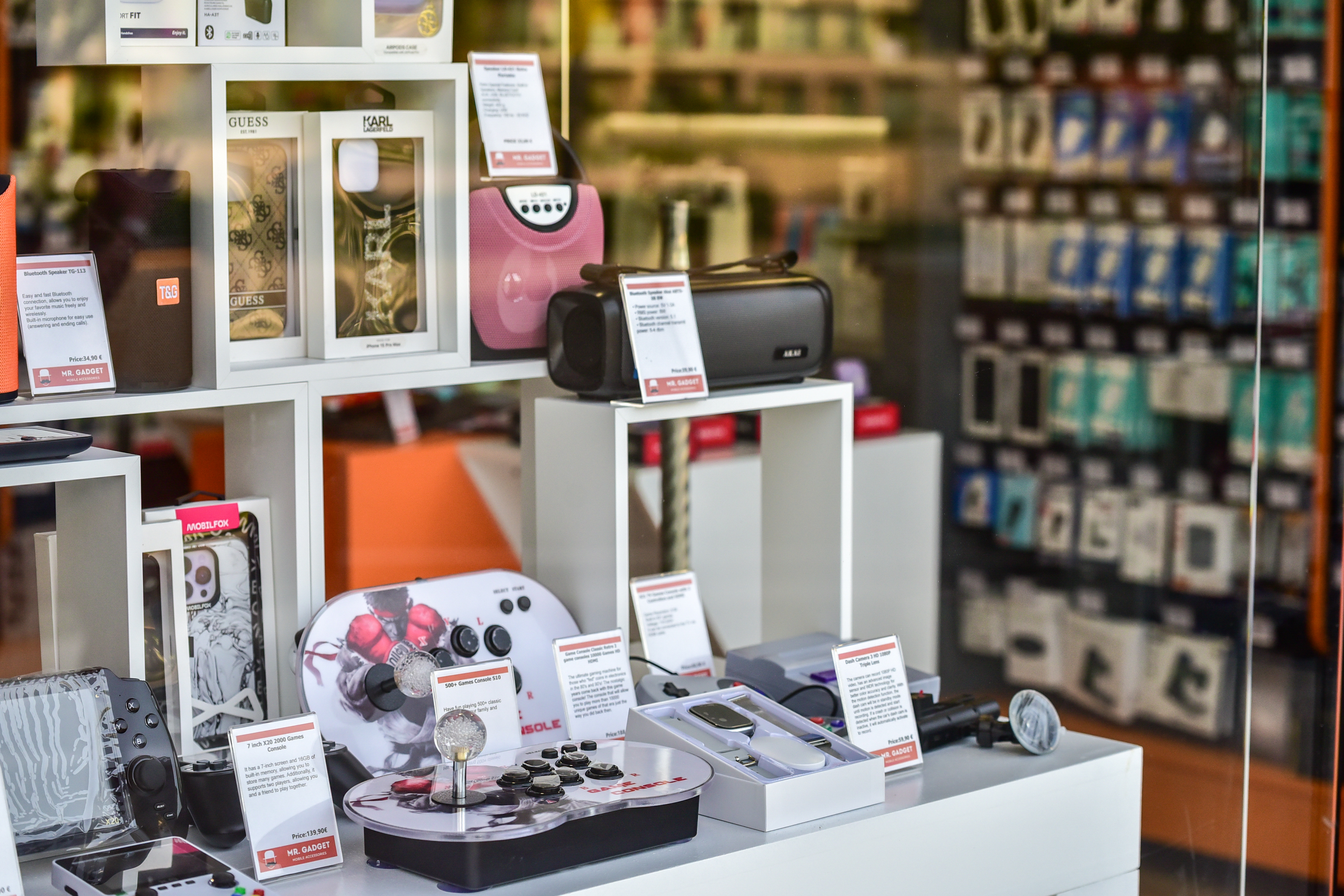 Bluetooth speakers, retro game consoles, and designer phone cases on display