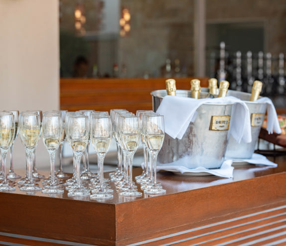 Champagne glasses and chilled bottles prepared for a wedding toast