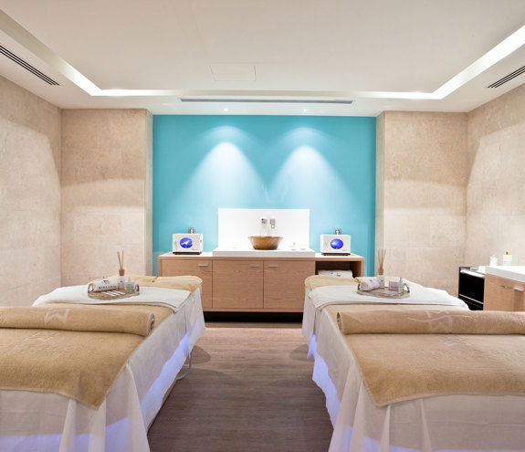 Interior of treatment room with massage beds, amenities and relaxing ambience