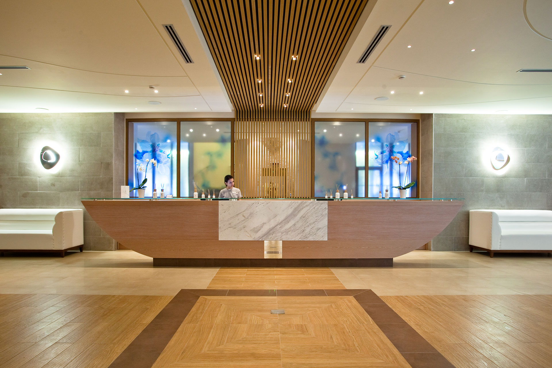 Elegant spa reception with modern wooden design and soft lighting