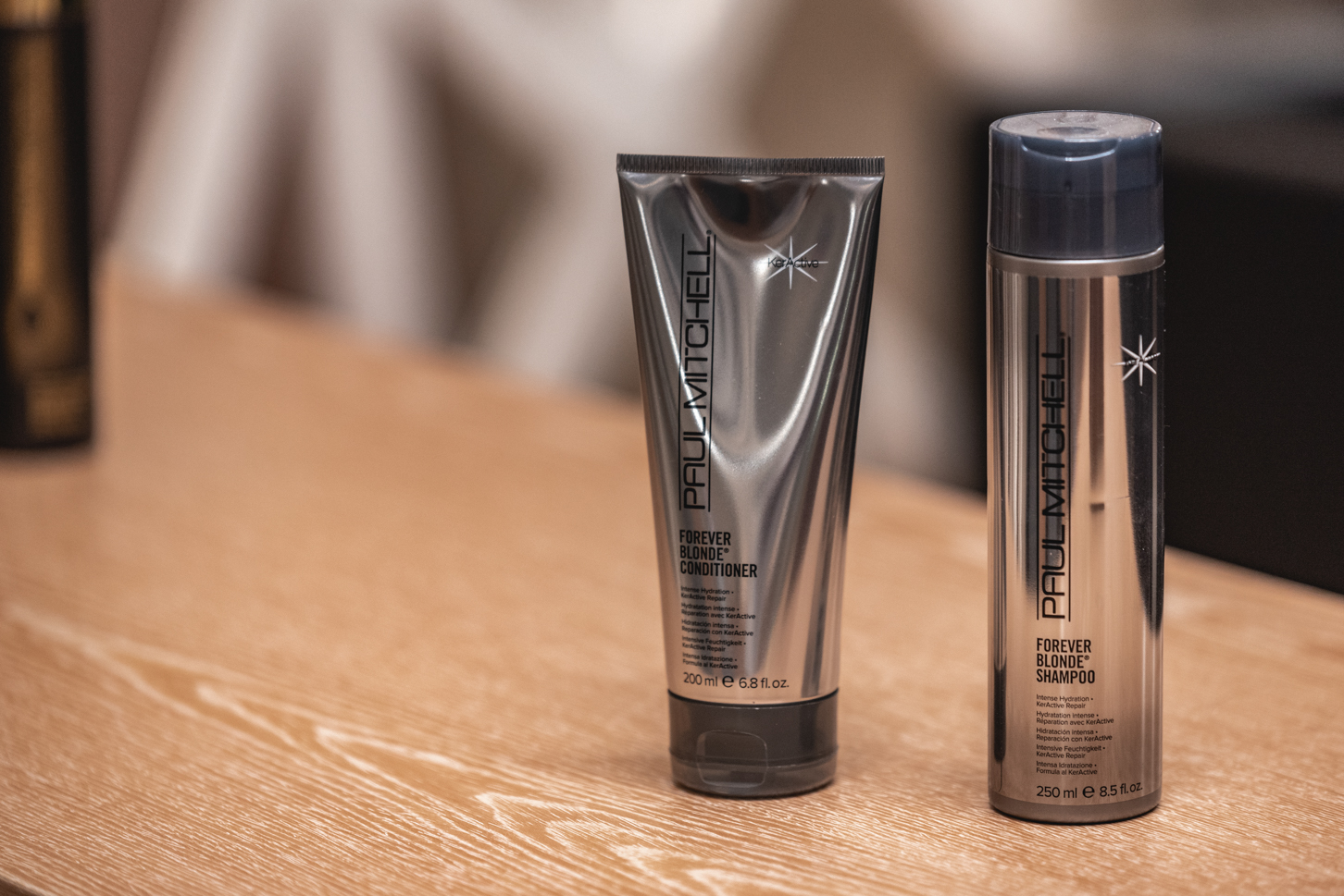 Paul Mitchell Forever Blonde shampoo and conditioner displayed at the beauty salon