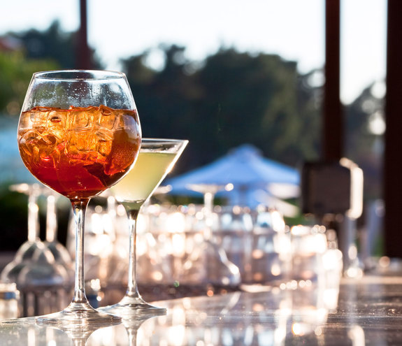 Refreshing cocktails served on the counter of Oasis Beach Bar under the summer light