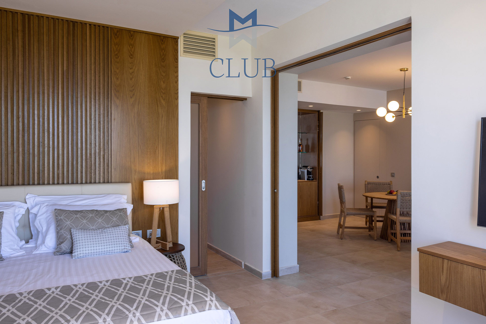 Spacious interior of suite, with separate bedroom, and living area