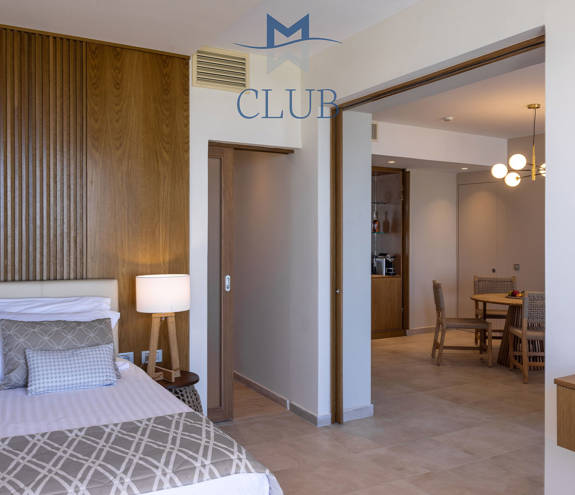 Pool Front Ground Floor Suite bed and kitchen chairs and table