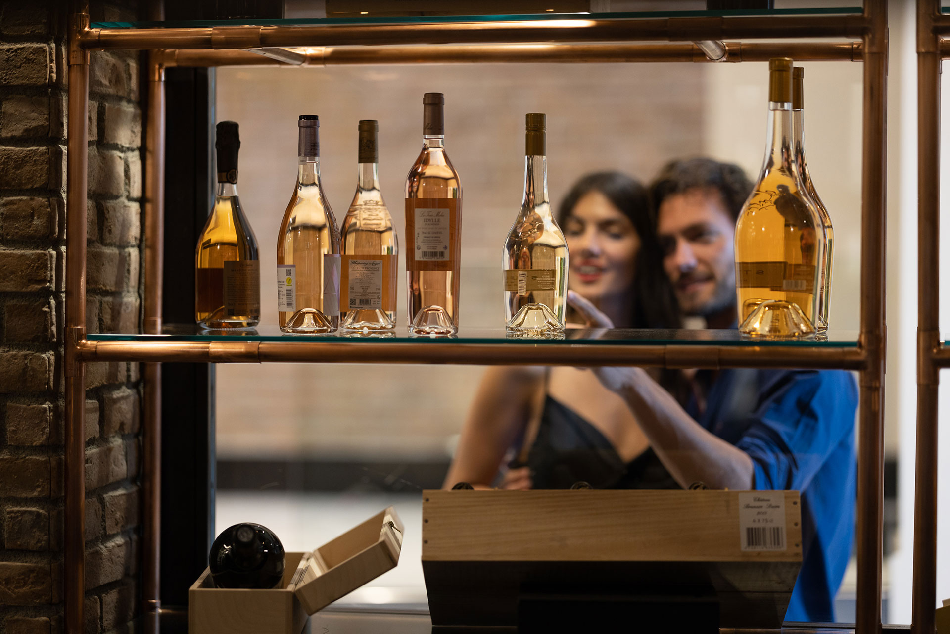 Couple browsing premium wine collection at Sommelier's 8 restaurant wine cellar