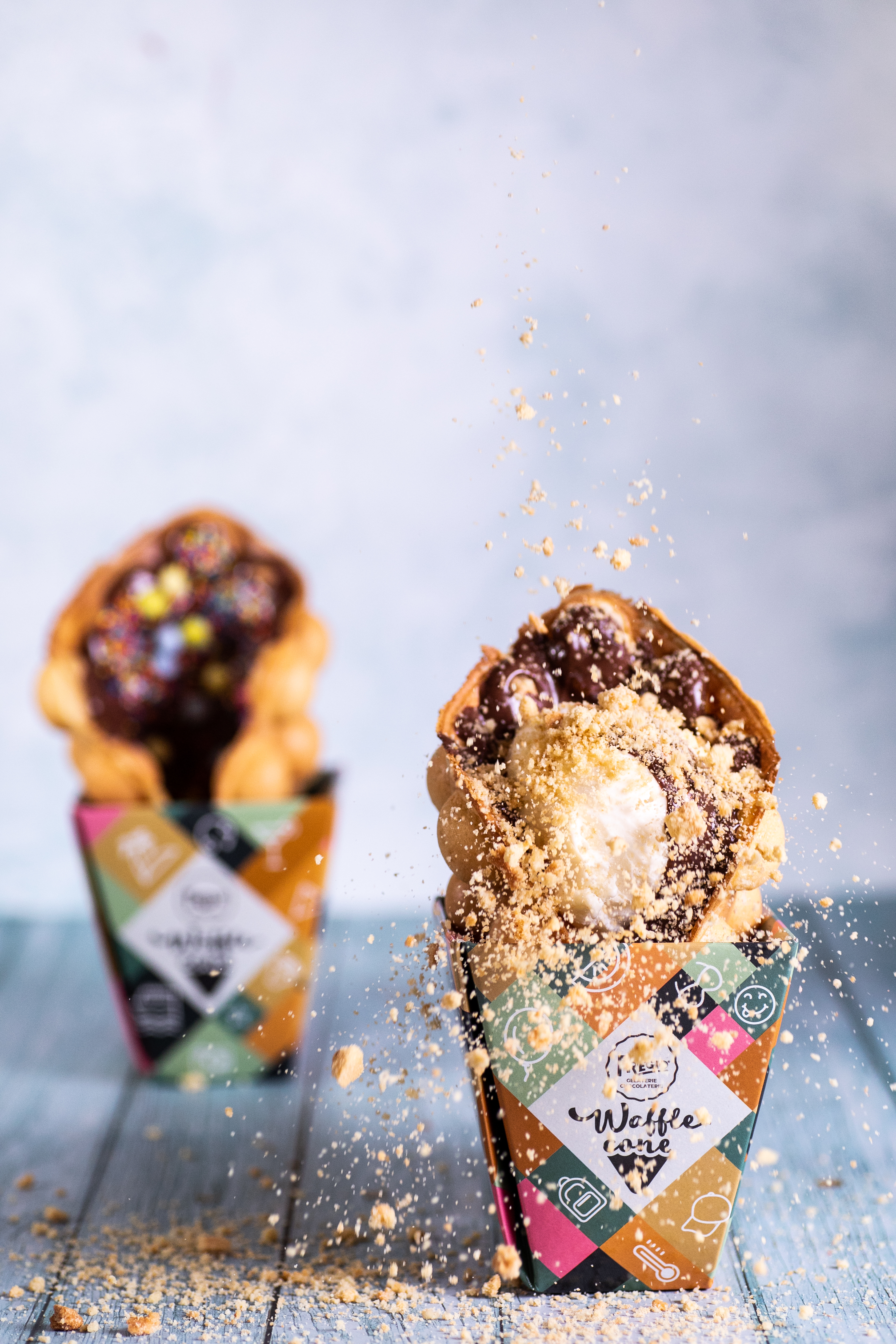 Fregio waffle cones filled with ice cream, chocolate, and biscuit crumble