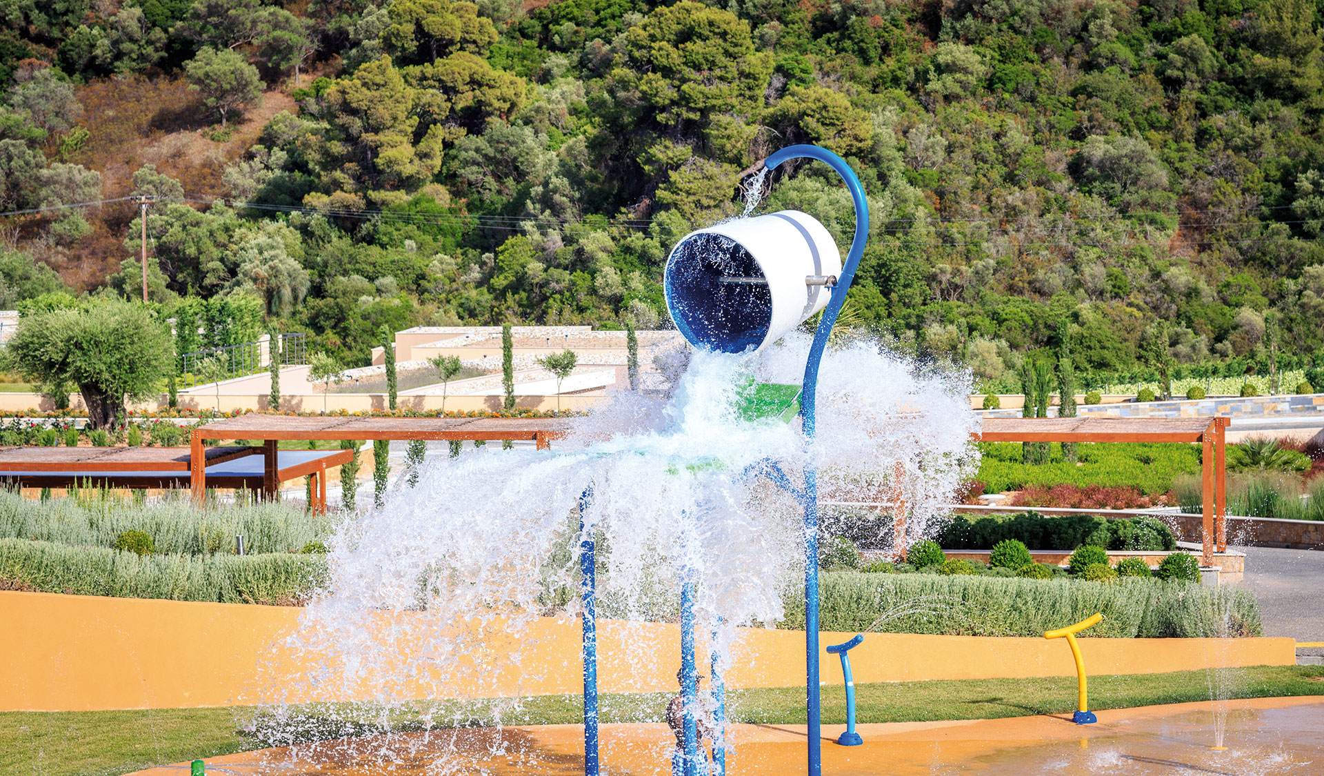Kids Planet outdoor tipping water bucket splash area with the gardens in the background