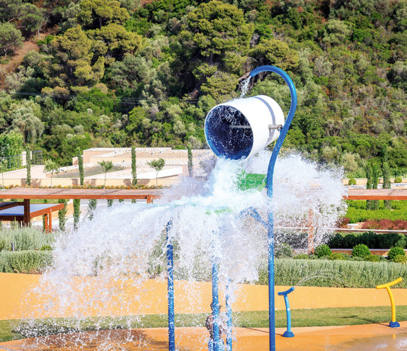 Kids Planet outdoor tipping water bucket splash area with the gardens in the background