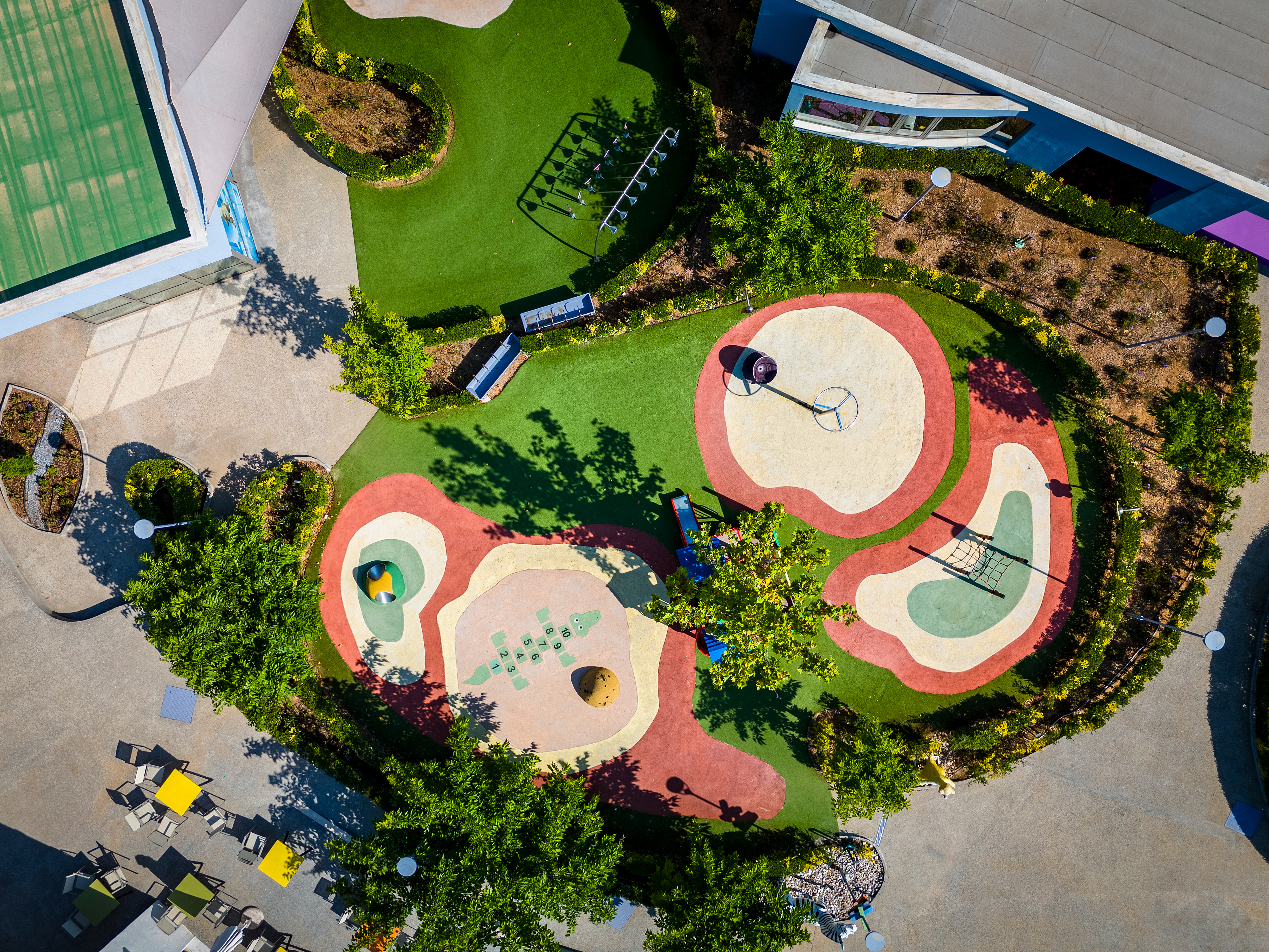 Top down aerial view of spacious outdoor playground of kids Planet