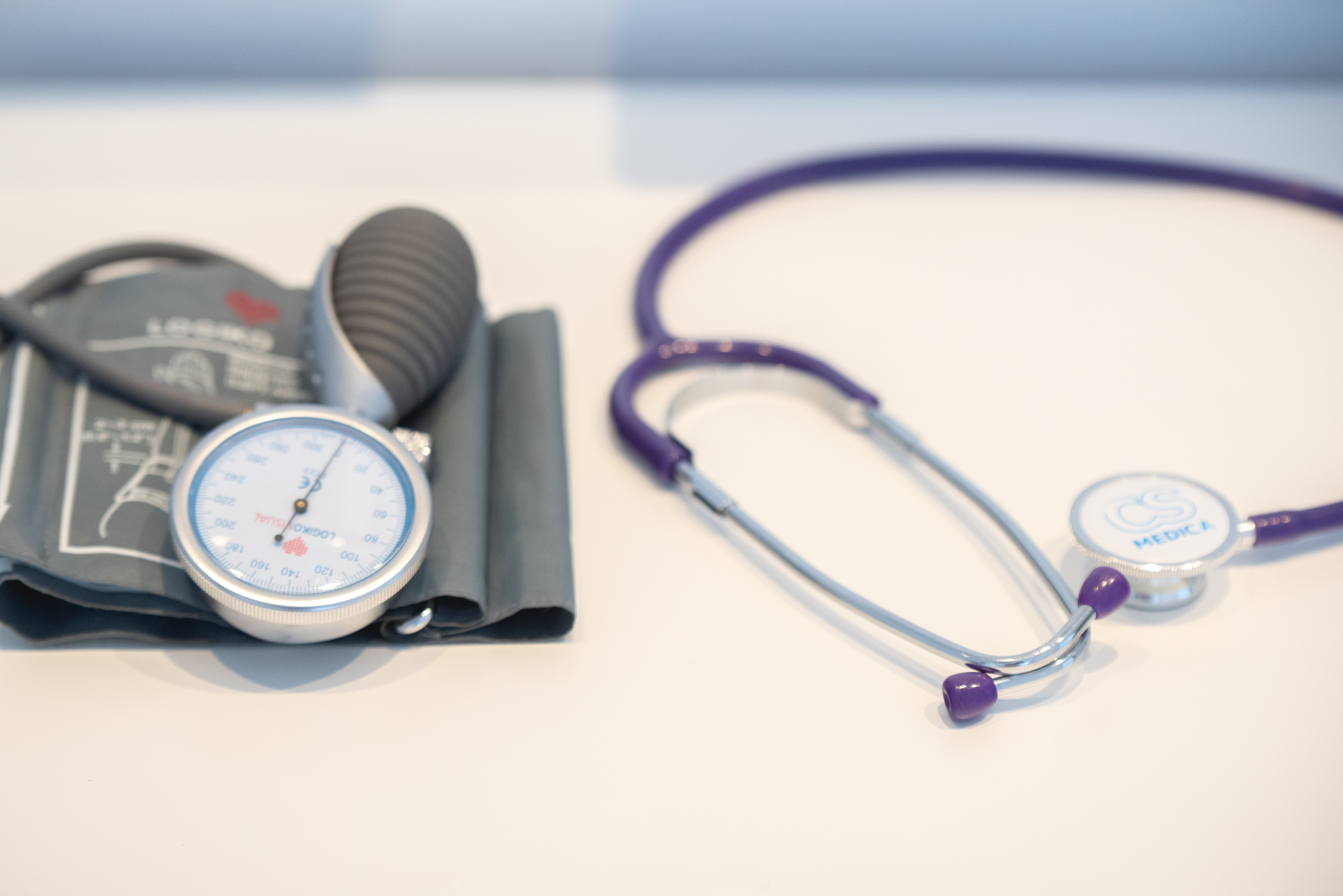Close up of medical equipment including a stethoscope and blood pressure monitor