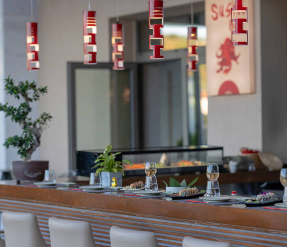 Sushi Bar decorated bar with dishes and glasses of wine