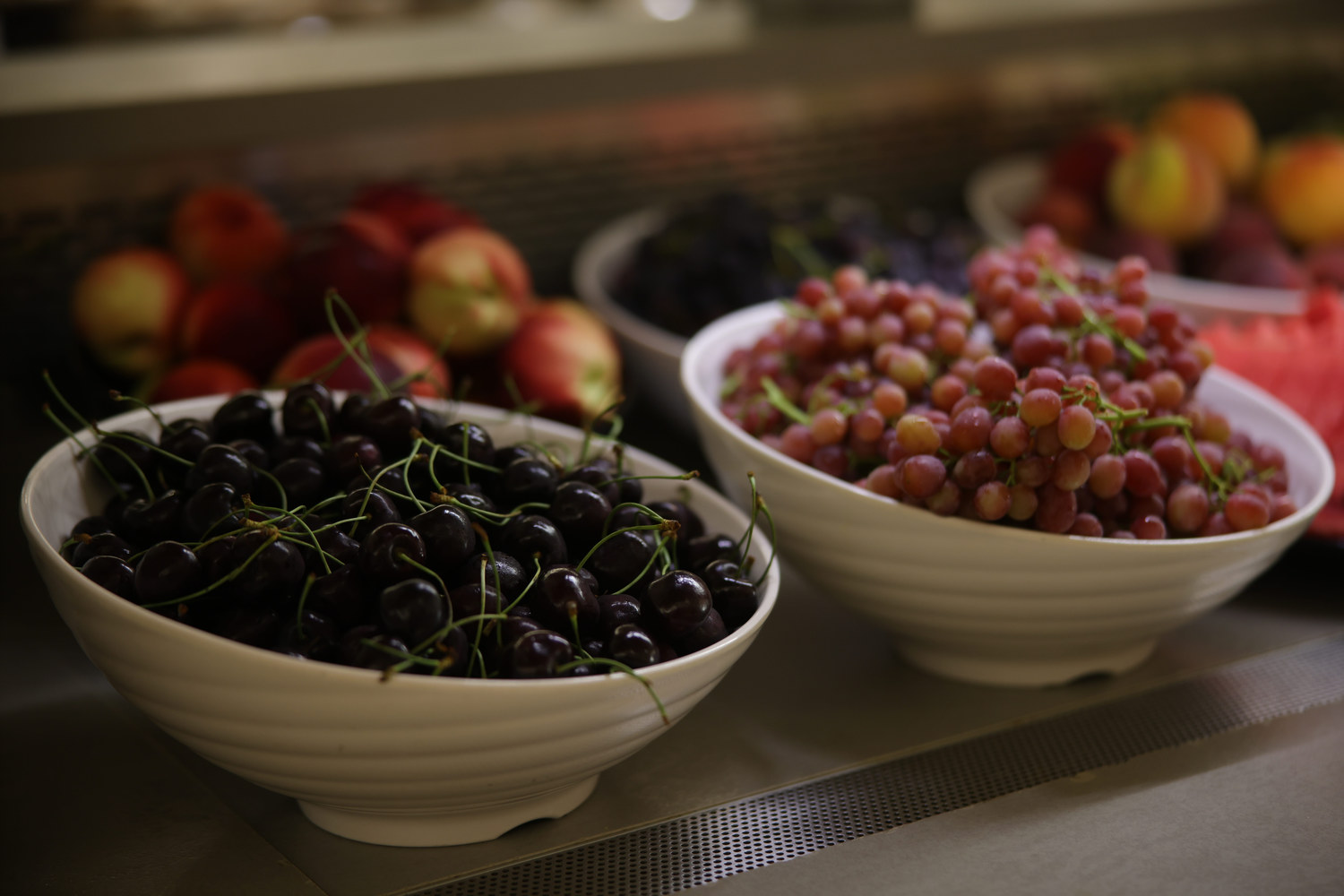 Close up to cherries and grapes at the fruit buffet of Kritamo restaurant