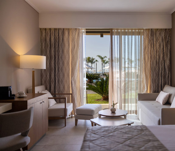 Deluxe Pool Front Room sofa, chairs and coffee tables