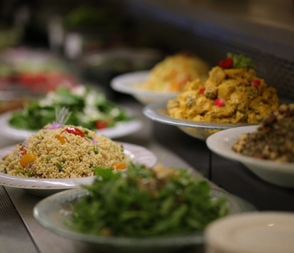 Close up to couscous salad dish and other gourmet plates in Kritamo restaurant boufet