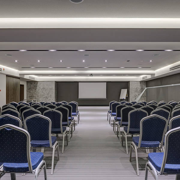 Miraggio Thermal Spa Resort conference presentation room blue chairs and whiteboard