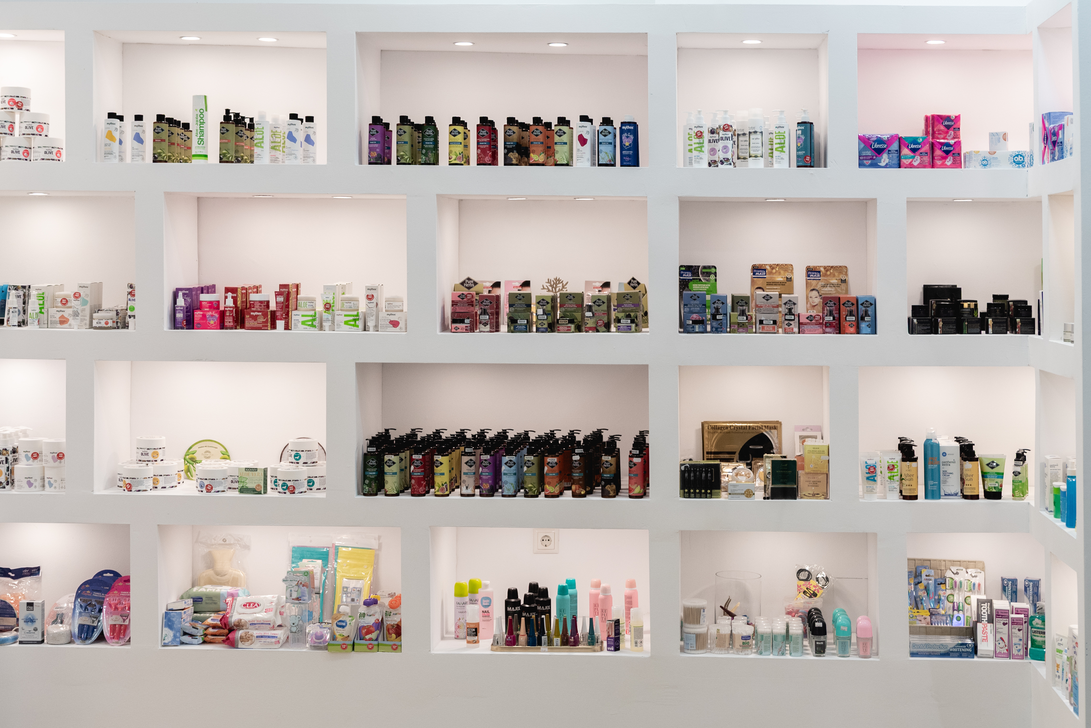 Shelves filled with skincare, haircare, and wellness products inside the pharmacy
