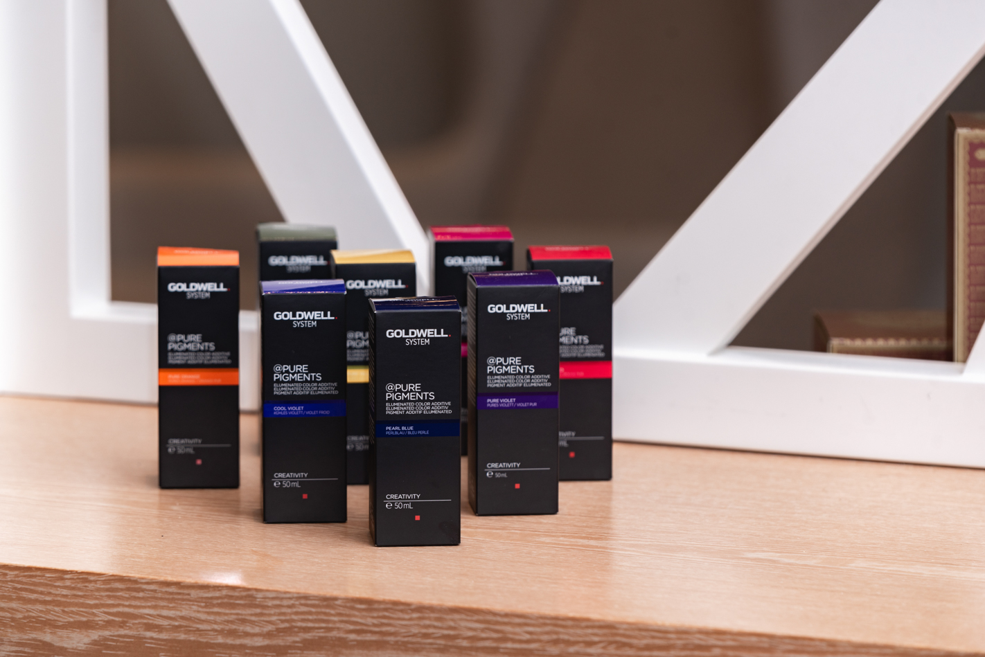 Goldwell Pure Pigments professional hair color products on display 