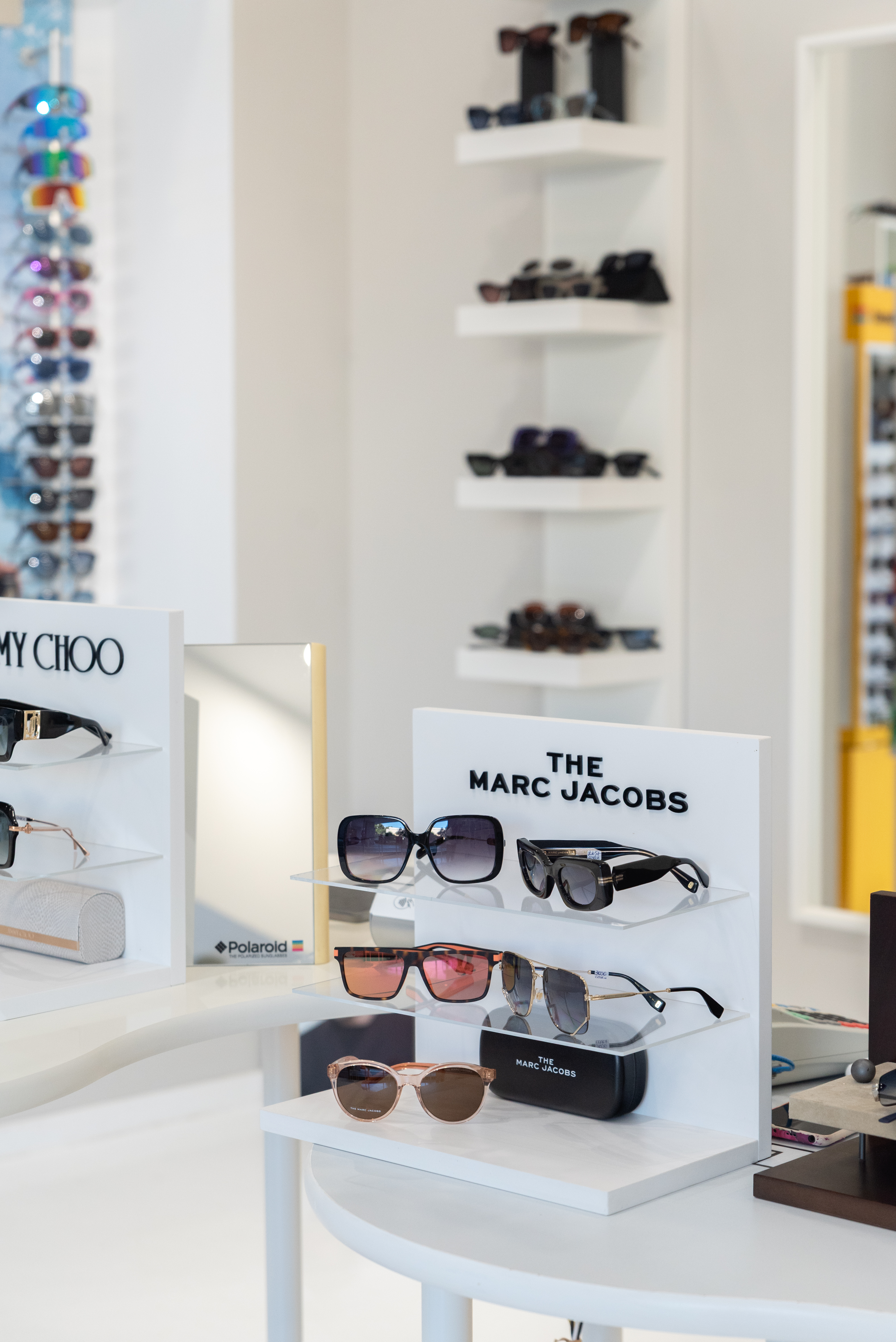 Luxury sunglasses display featuring The Marc Jacobs and Jimmy Choo collections inside Optikon Xpress