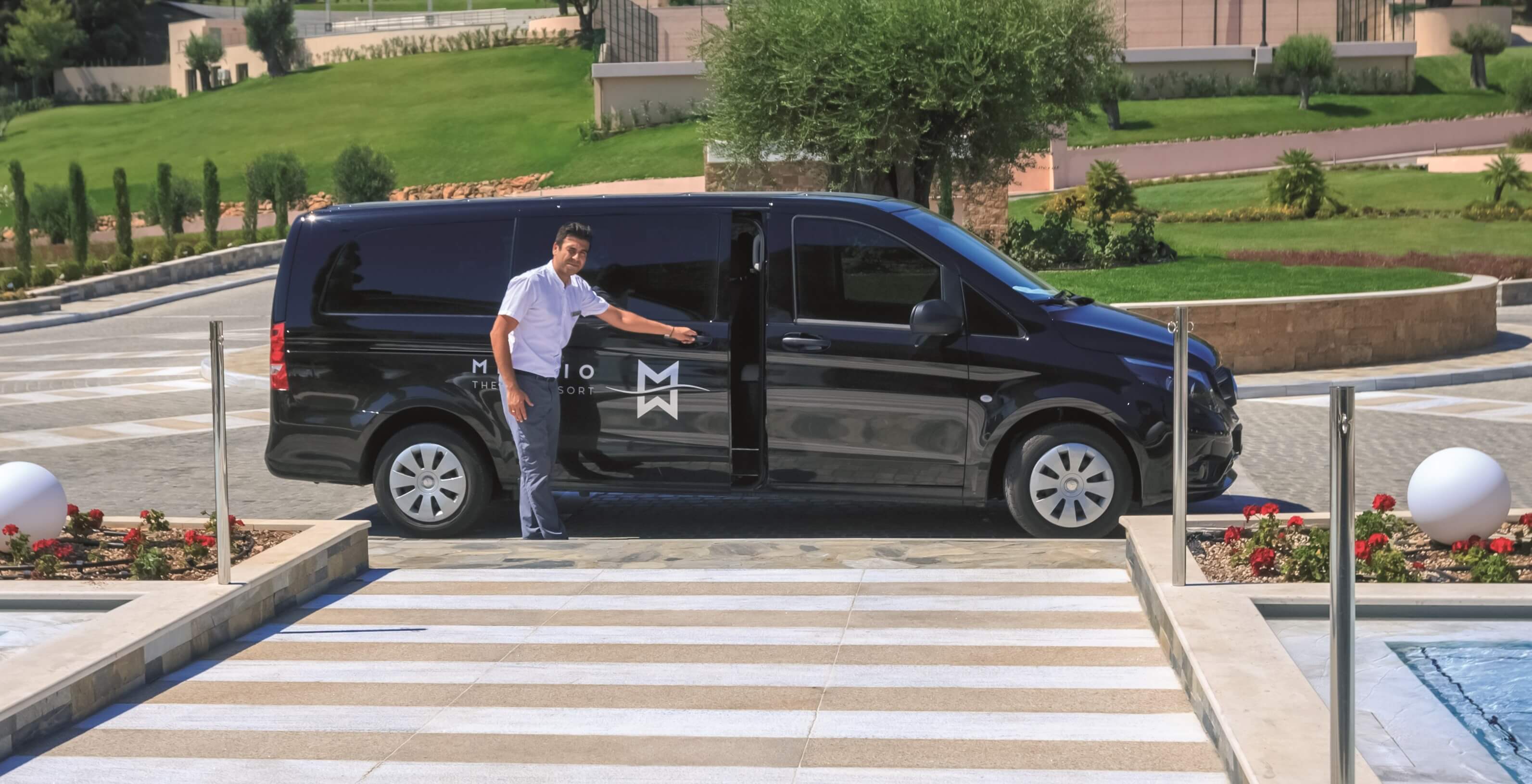 Driver opens his van waiting for guests in Miraggio Thermal Spa Resort