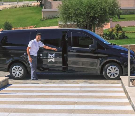 Driver opens his van waiting for guests in Miraggio Thermal Spa Resort