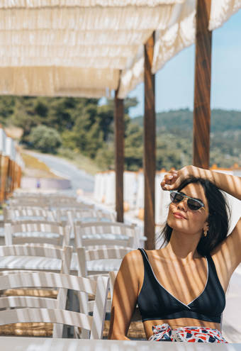 Woman relaxing at Mezedaki Beach Restaurant