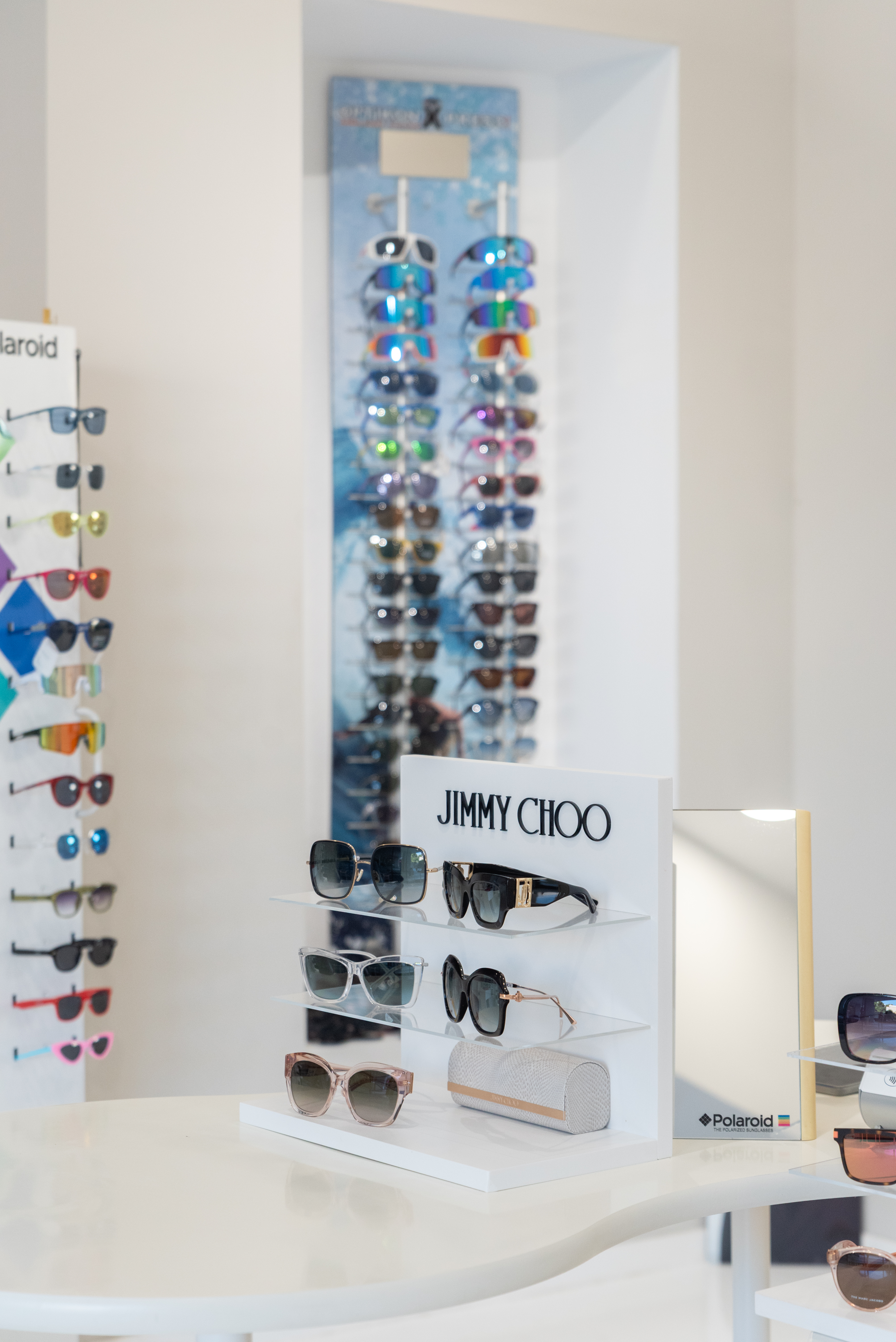 Elegant Jimmy Choo sunglasses display with mirrored lenses and luxury frames