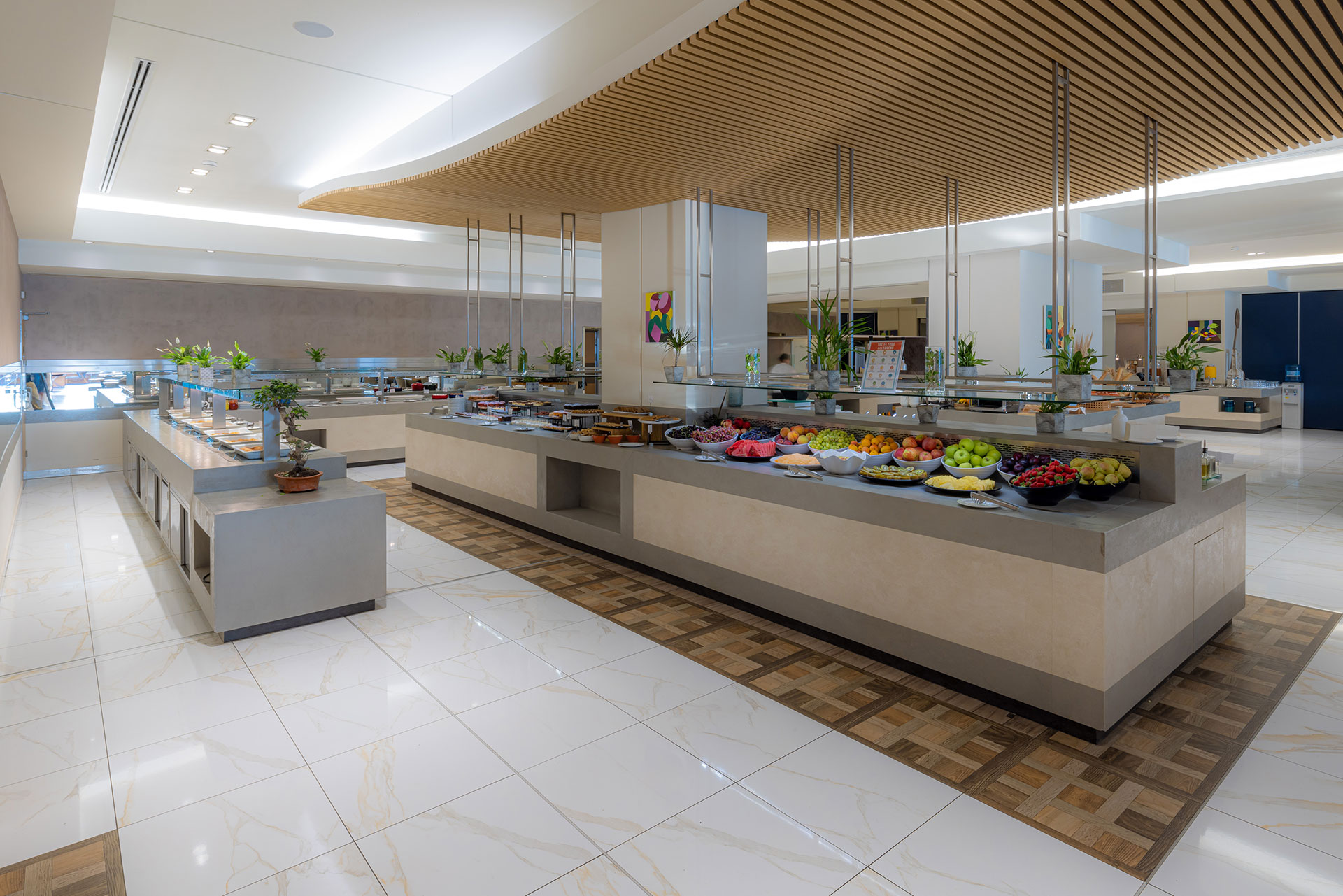 Kritamo restaurant elegant and bright buffet area featuring fruits and pastries