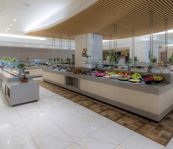 Kritamo restaurant elegant and bright buffet area featuring fruits and pastries