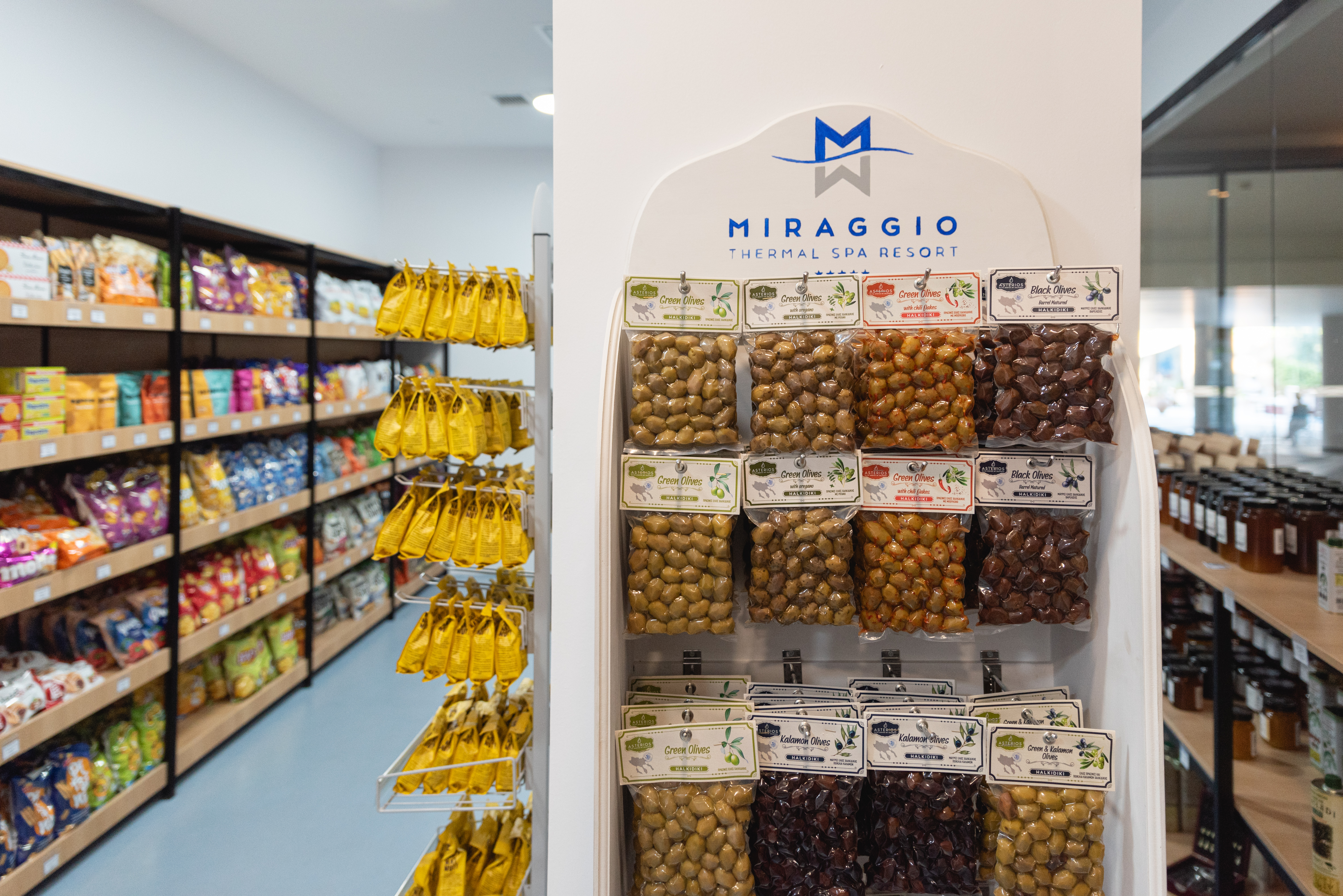 Shelf display of Greek olives and local delicacies inside the Miraggio Thermal Spa Resort mini market