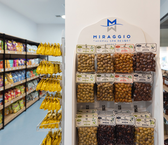 Shelf display of Greek olives and local delicacies inside the Miraggio Thermal Spa Resort mini market