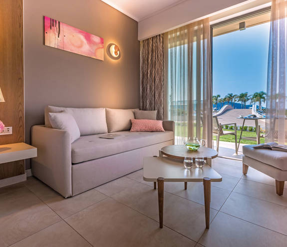 Deluxe Pool Front Room sofa, table and decorations