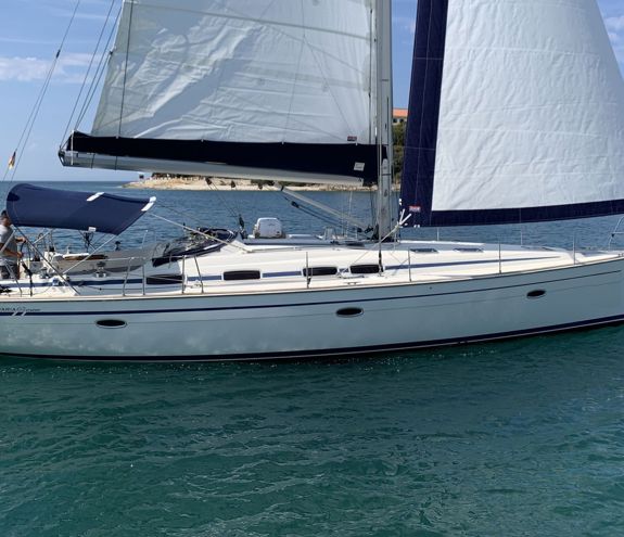 Sailing yacht Bavaria 46 cruiser gliding on calm blue waters near Halkidiki
