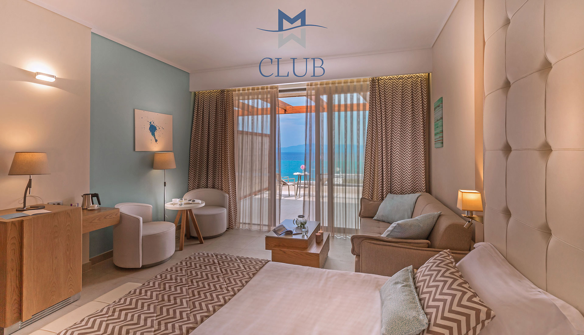 Cozy sea view room with warm lighting, designer furnishing, king size bed and private terrace with sea view