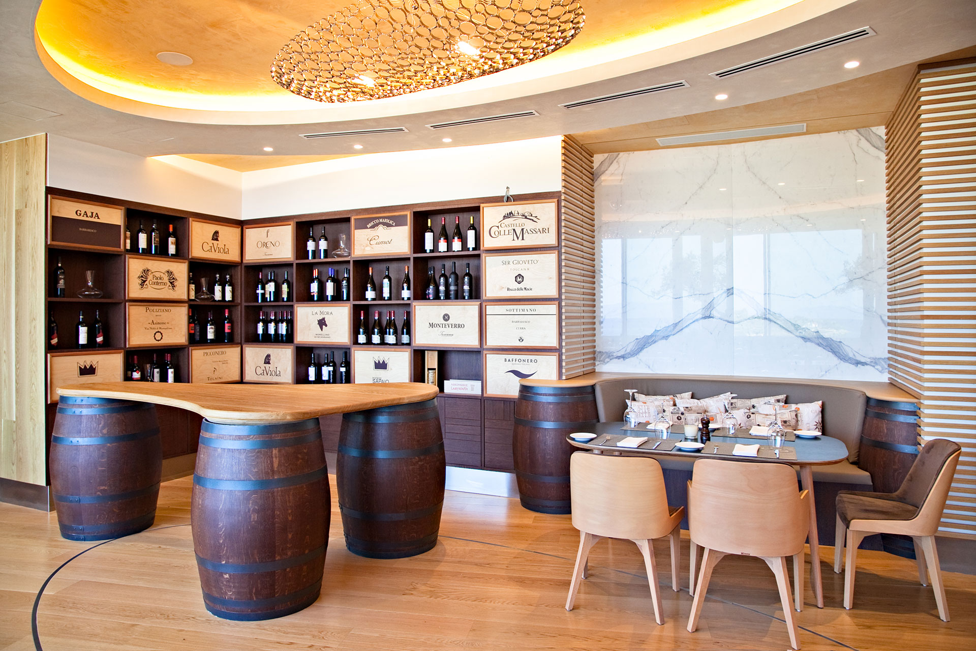 Portofino wine corner with wooden counter on wine barrels and table for wine taste