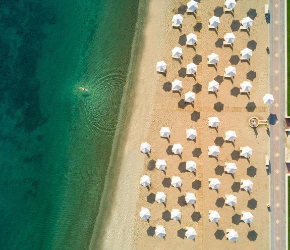 Top-down view of the beach and umbrellas