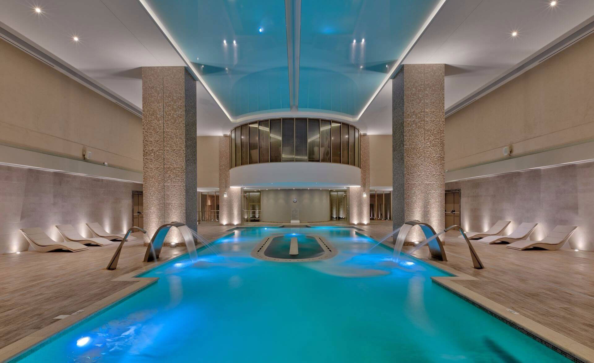 Indoor thermal spa pool with hydrotherapy jets and elegant lounge area