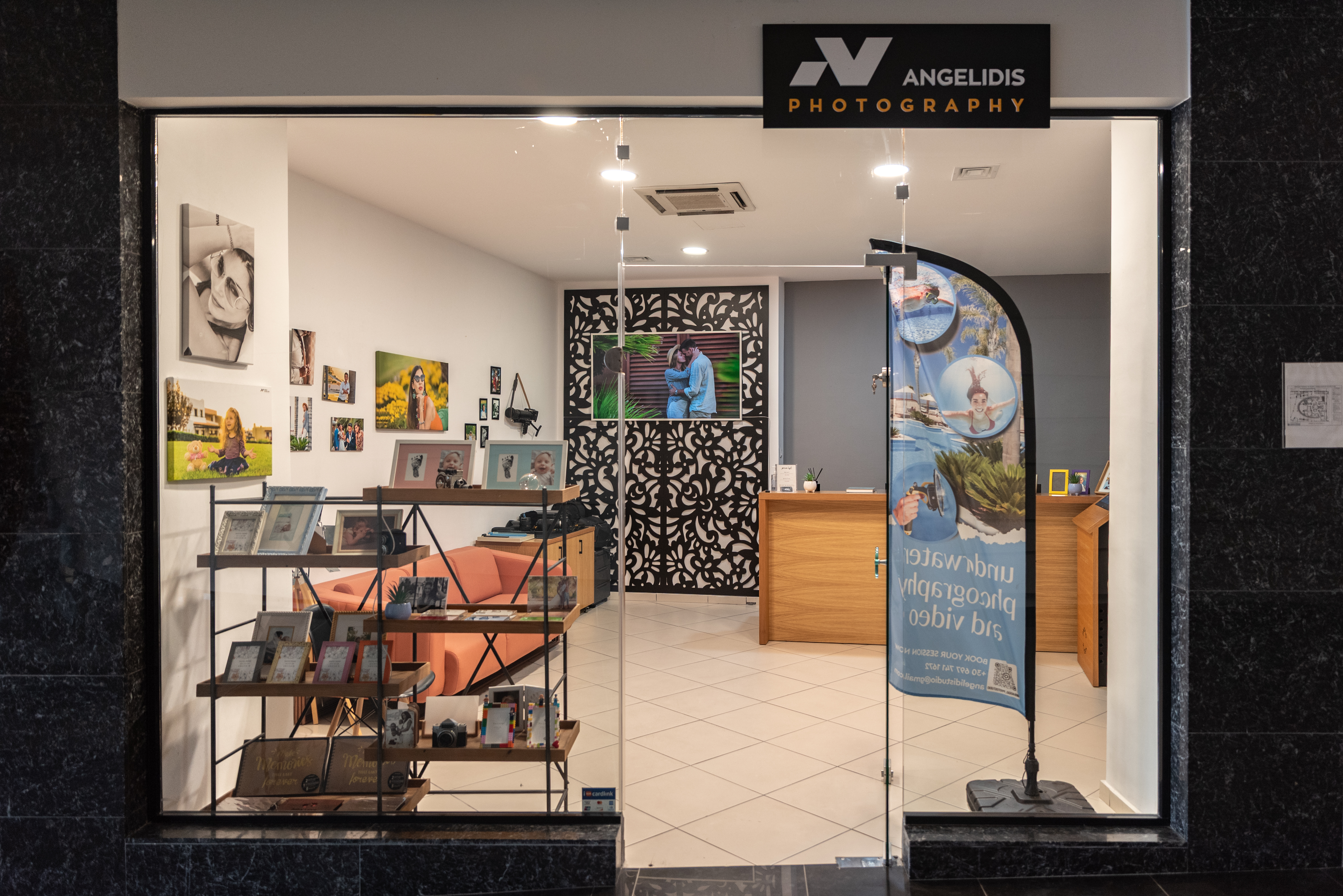 Angelidis Photography shop interior with photo frames, cameras, and professional equipment