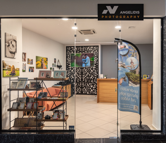 Angelidis Photography shop interior with photo frames, cameras, and professional equipment