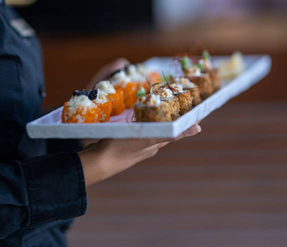 Sushi Bar dish being served by the waiter