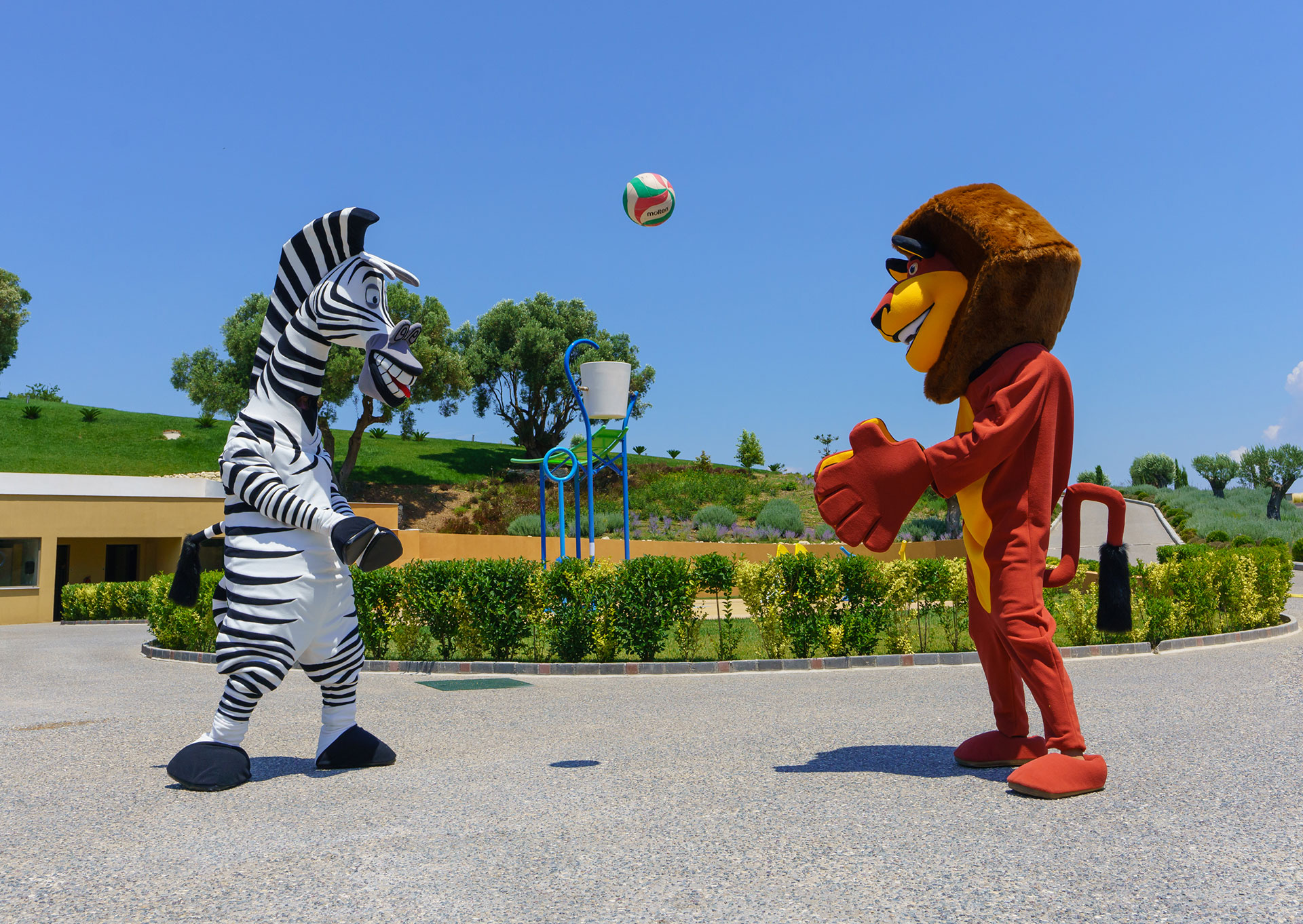 Performers in zebra and lion costumes in the Kids Planet