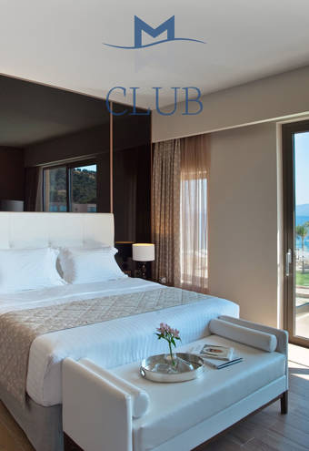 Duplex Sea View Private Pool Suite bed, decorations and balcony view