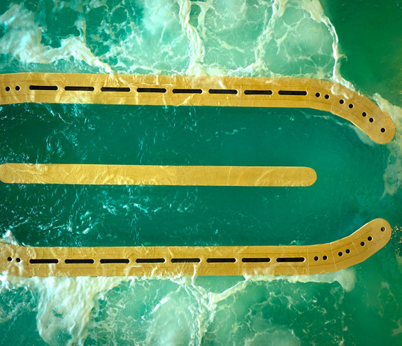 Overhead view of the hydrotherapy circuit pool with bubbling jets and golden walkways